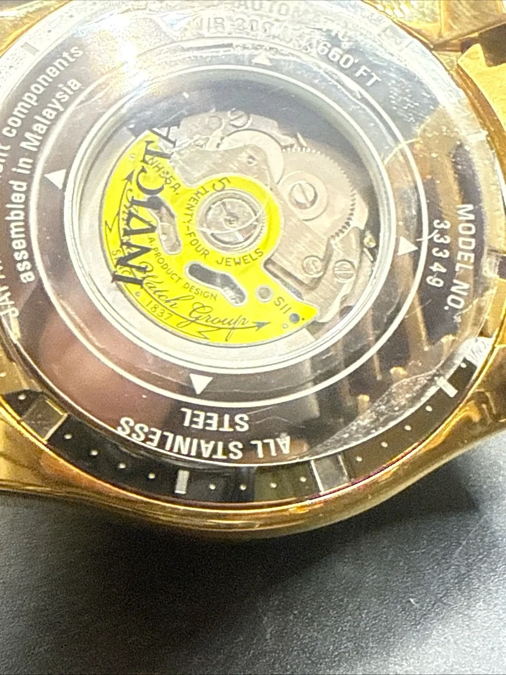 Invicta Excursion model 33349 MOP Dial Purple Gold Tone